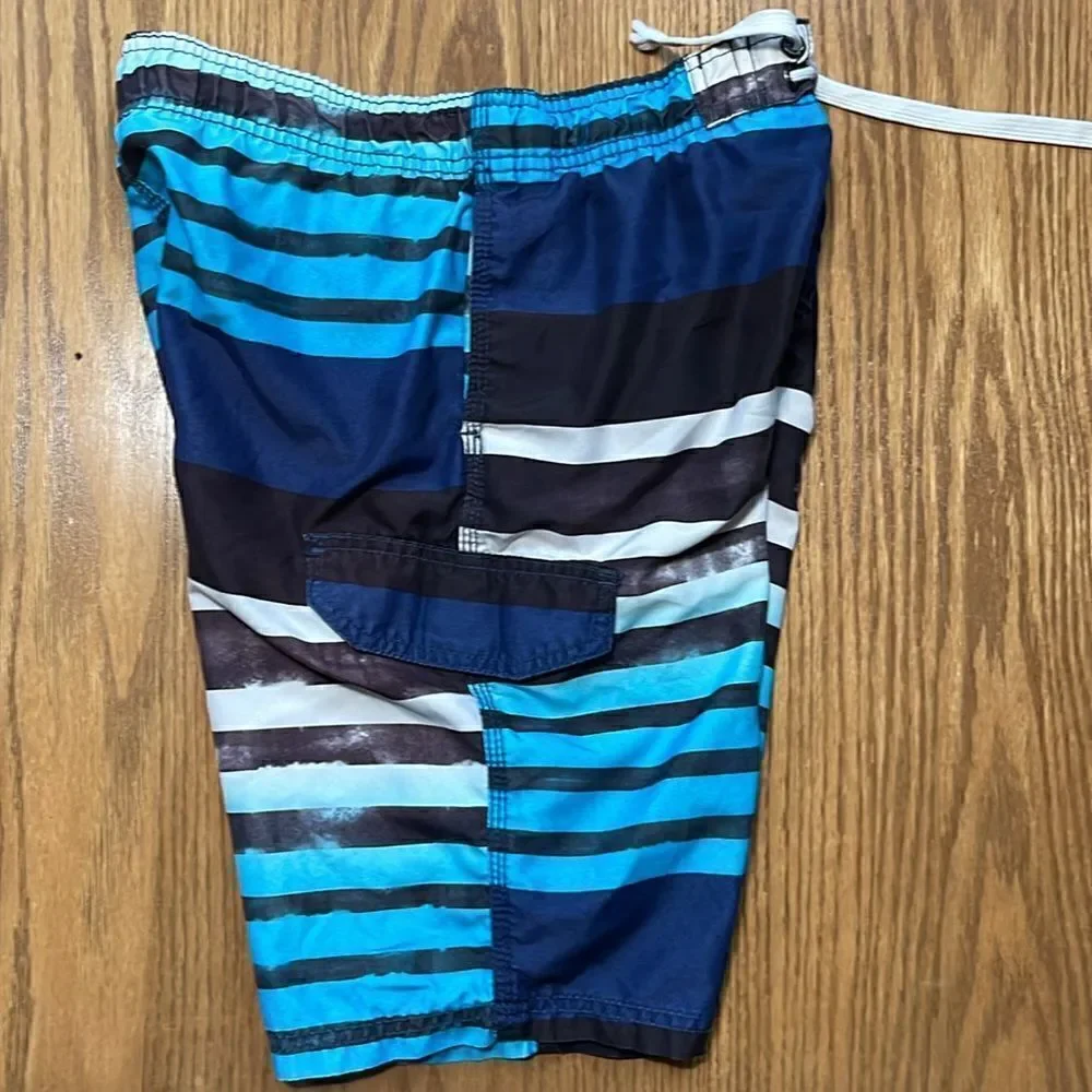 Kanu surf swimming shorts. Drawstring waist. Size medium. Size 10/12. Pocket.